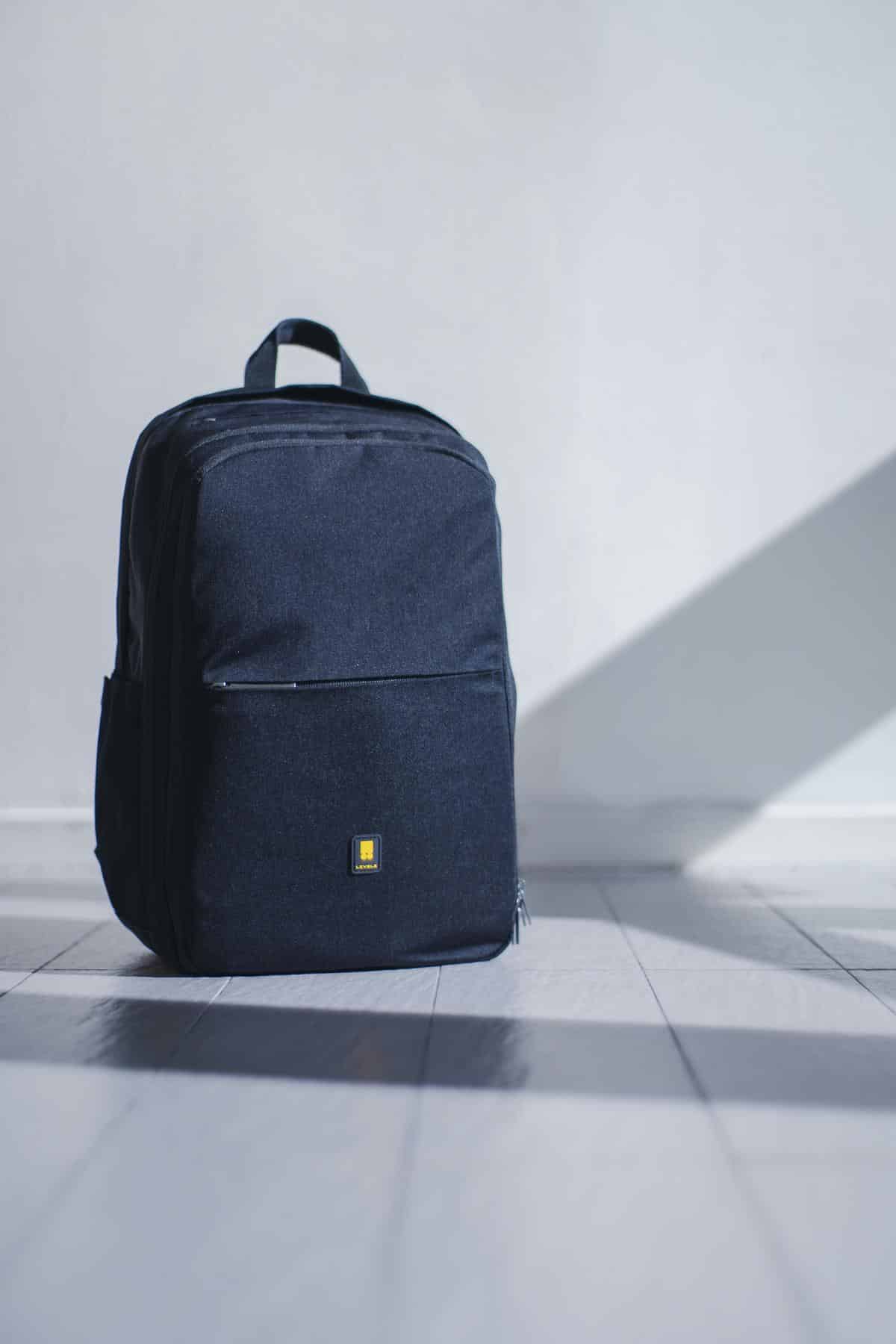 Image of a Halo Infinite backpack with cushioned laptop sleeve, integrated USB charging port, reflective elements, hydration bladder compartment, and ergonomic design, representing its innovative features and style.
